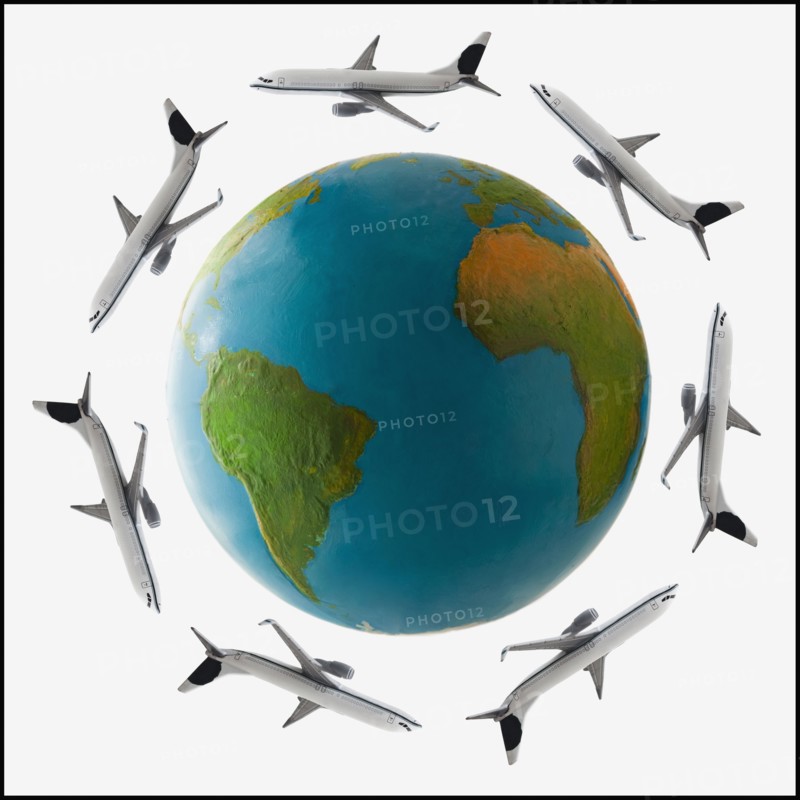 Jets flying around globe. Photo. Mike Kemp