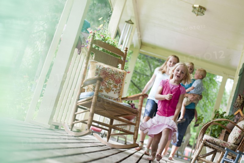 Family on porch. Photo : Tim Pannell