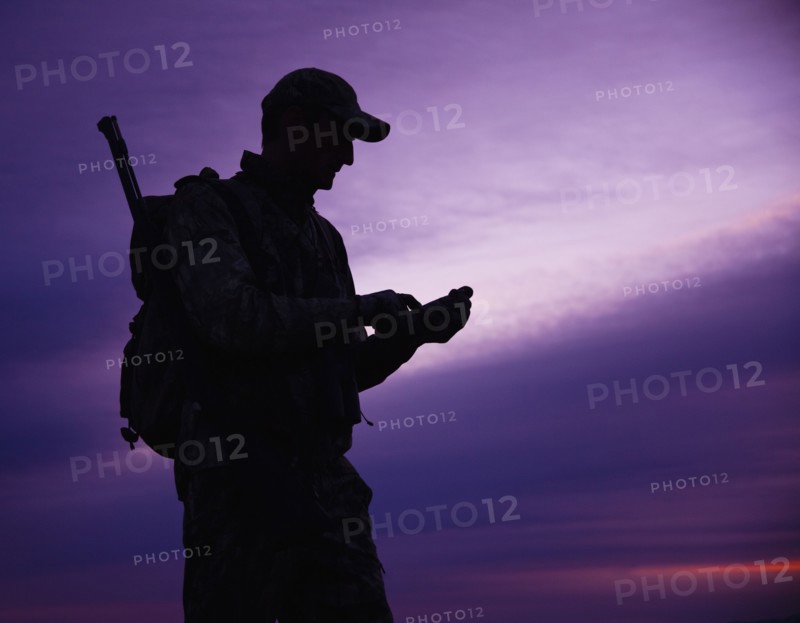 Big game hunter at dusk. Photo. Mike Kemp