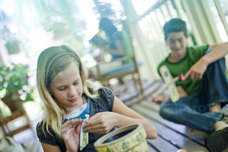 Young girl opening a seed packet. Photo. Tim Pannell