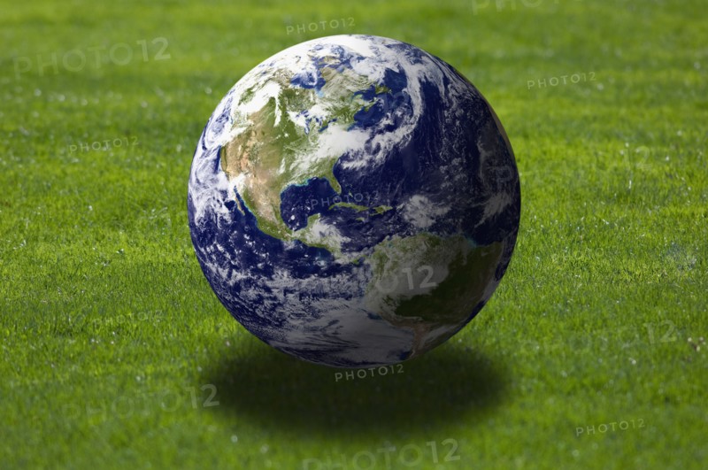Earth over grass field