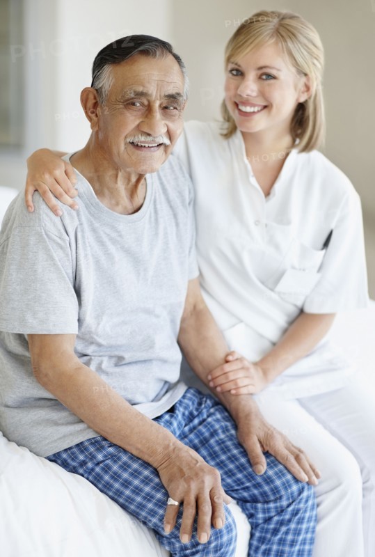 Nurse sitting with patient. Photo. momentimages