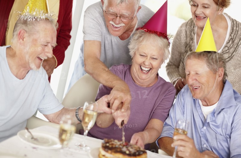 Senior woman's birthday party. Photo. momentimages