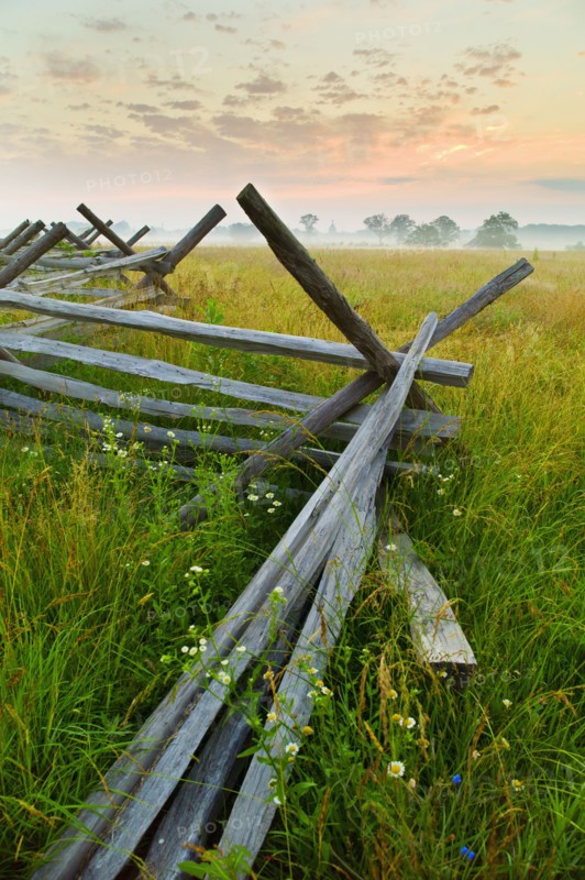 Rustic fence in field.