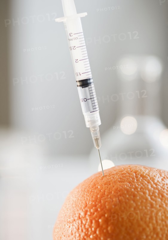 Syringe in orange. Photo. Jamie Grill