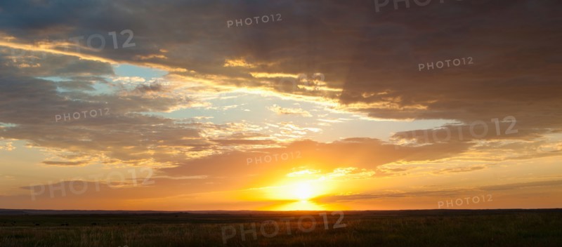 Sunset above prairie.