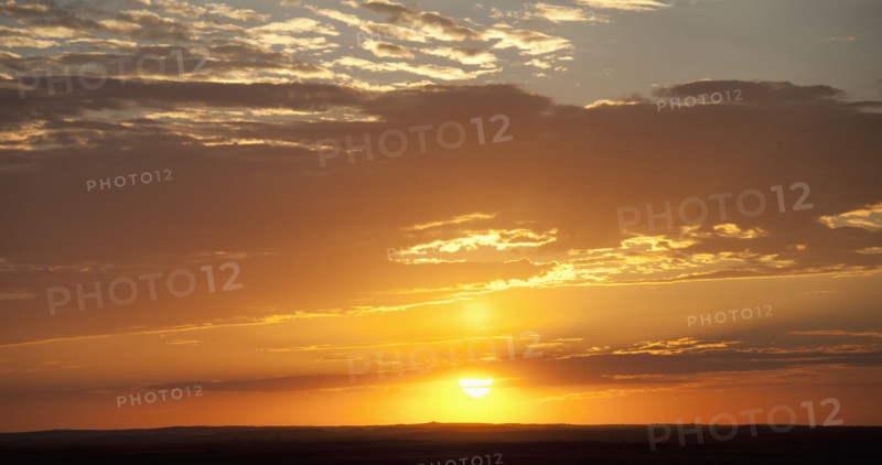 Sunset above prairie.