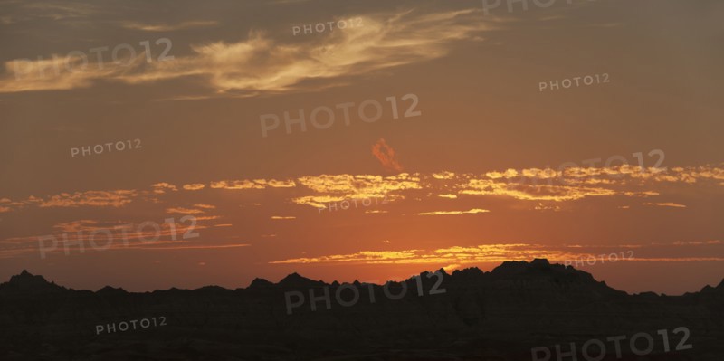 USA, South Dakota, Mountains in Badlands National Park at sunset.