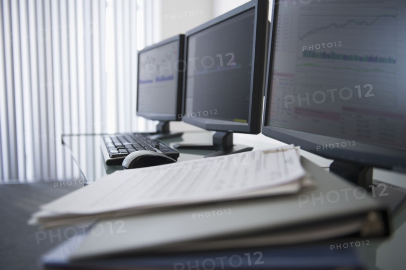 Close up of computer monitors in office.