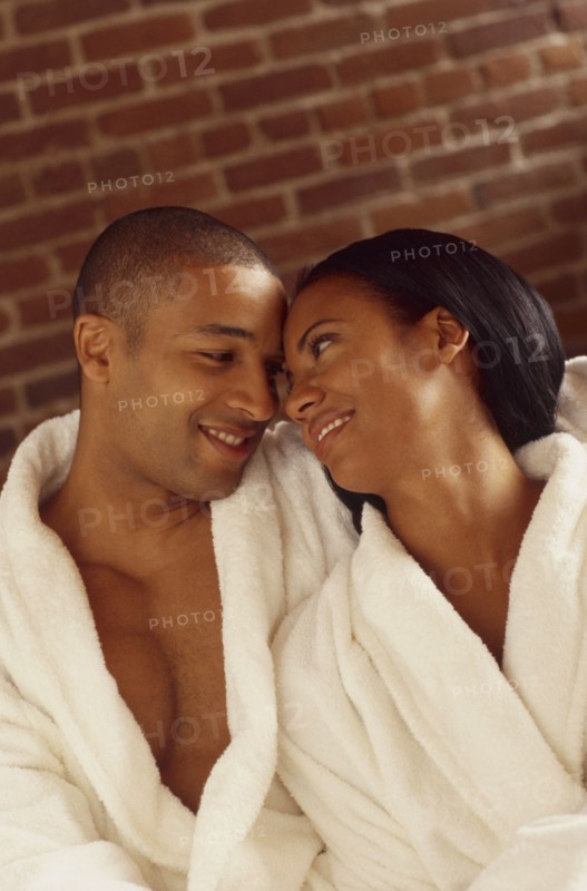 Happy couple wearing bathrobes. Photo : Fisher Litwin