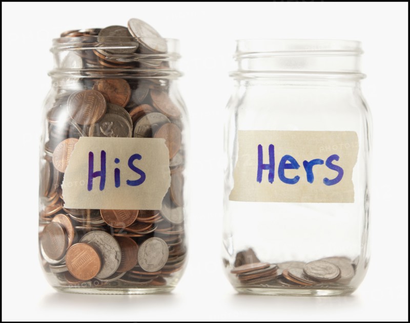 Studio shot of two jars with coins labeled "Hers" and "His". Photo : Mike Kemp