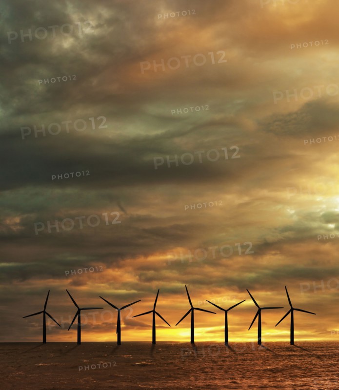 Wind turbines in sea at sunset. Photo : Jon Boyes