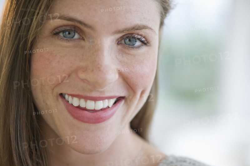Portrait of smiling young woman.