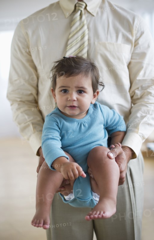 Father with small girl (12-18 months).
