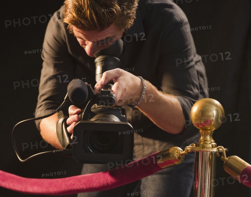Cameraman at red carpet event. Photo : Jamie Grill