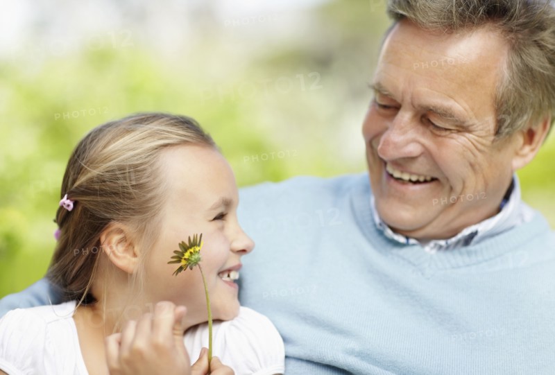 Happy grandfather and granddaughter (10-11). Photo : Momentimages