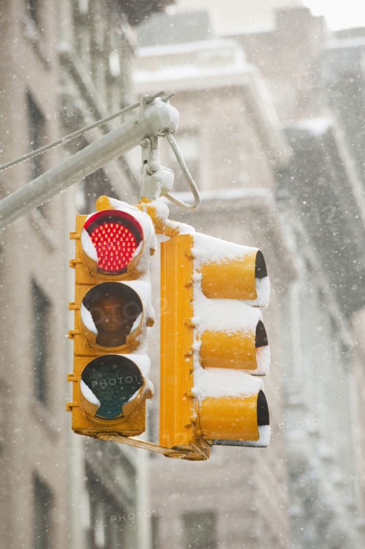USA, New York, New York City, Snow covered traffic lights.