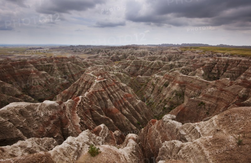 USA, South Dakota, Thick gray clouds over mountains in Badlands National Park.
