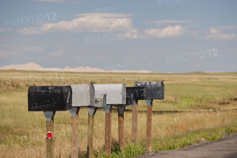 USA, South Dakota, Row of rural mailboxes on roadside in Buffalo Gap National Grasslands.