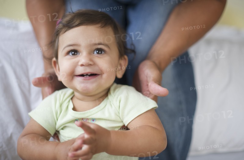 Father with small girl (12-18 months).