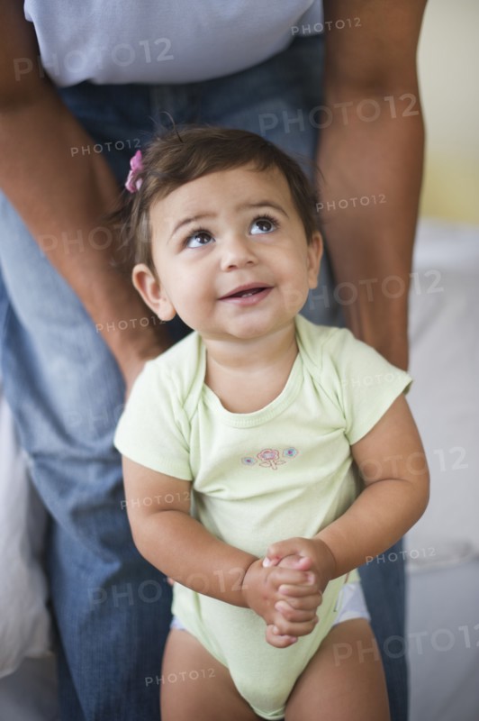 Father with small girl (12-18 months).