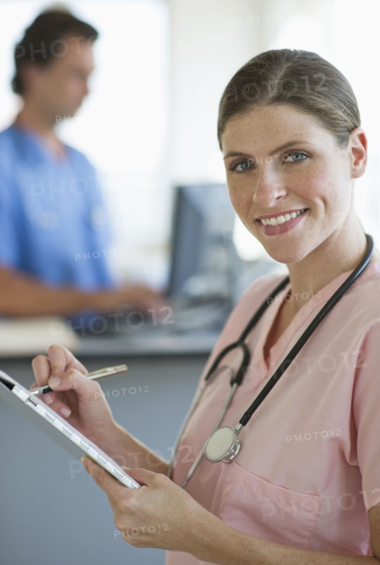 Smiling female doctor in hospital.
