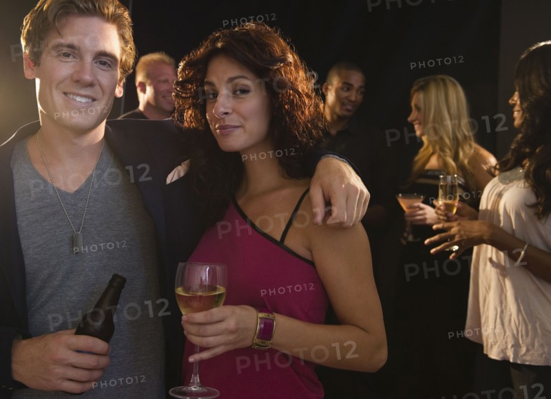 Portrait of couple embracing at nightclub. Photo : Jamie Grill