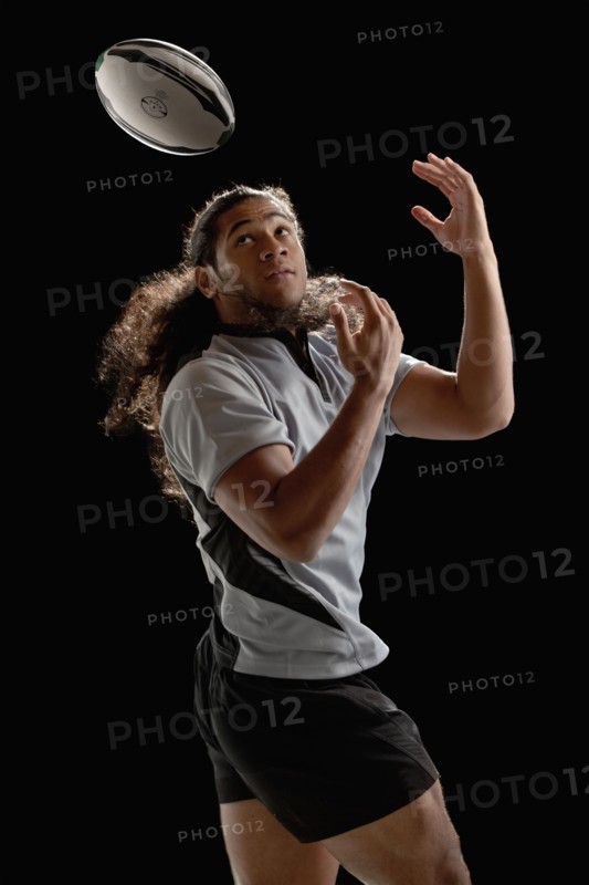 Male rugby player catching ball. Photo : Mike Kemp