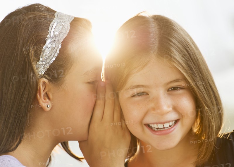 Girls (8-9,12-13) whispering. Photo : Daniel Grill