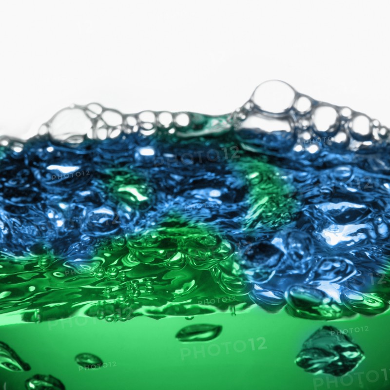 Close up of blue and green water surface with bubbles. Photo : David Arky