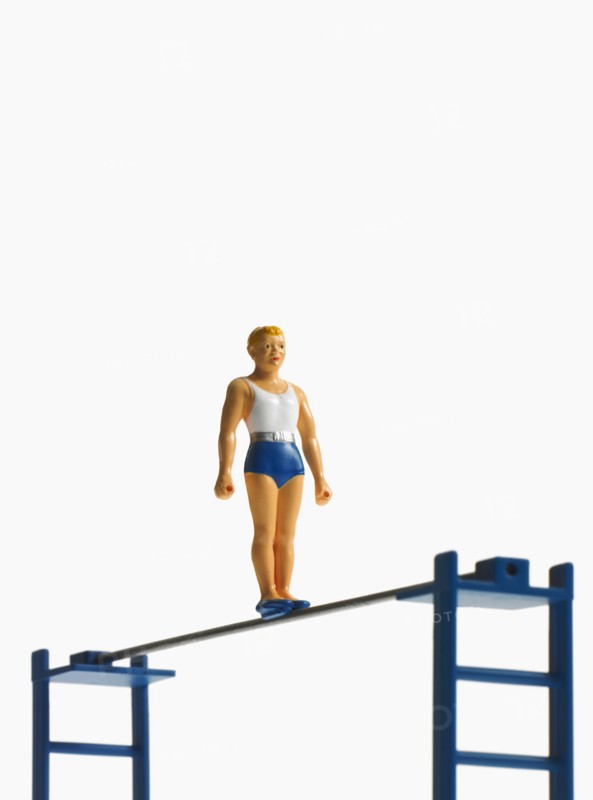 Studio shot of figurines on ladders. Photo : David Arky