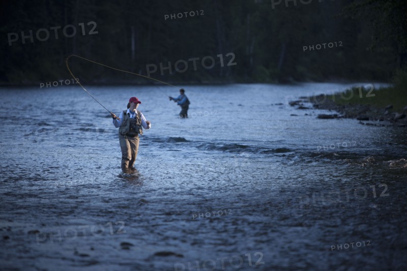 Canada, British Columbia, Fernie, Women fly fishing in river. Photo : Dan Bannister