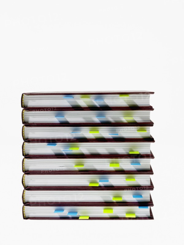 Studio shot of heap of books with index cards. Photo : David Arky