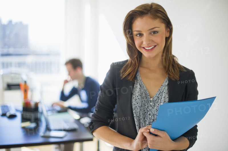 USA, New Jersey, Jersey City, Two young people in office.