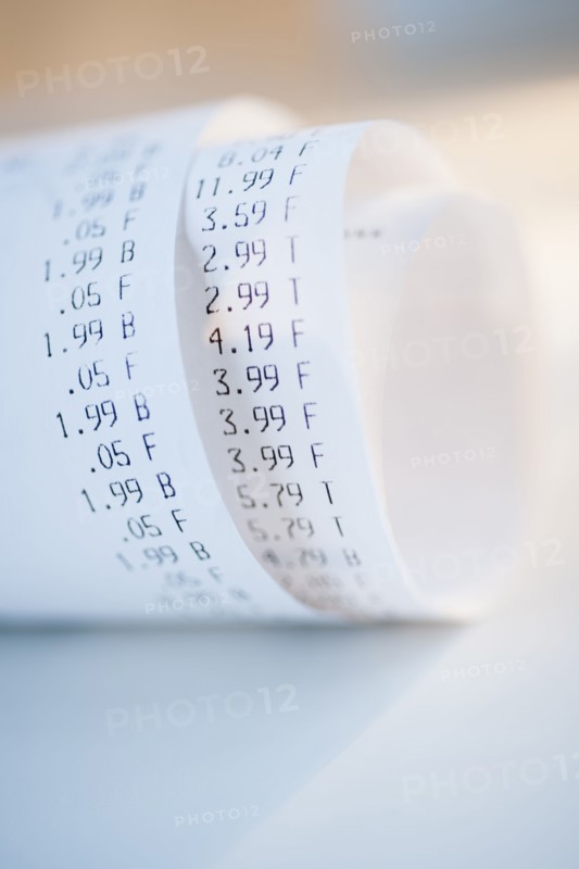 Rolled up receipts with prices.
