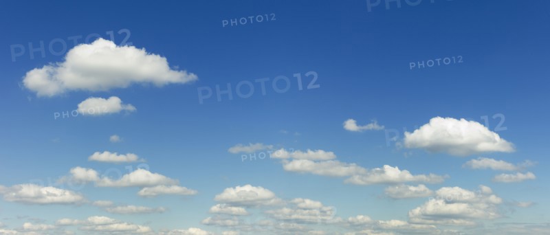 White puffy clouds in sky.