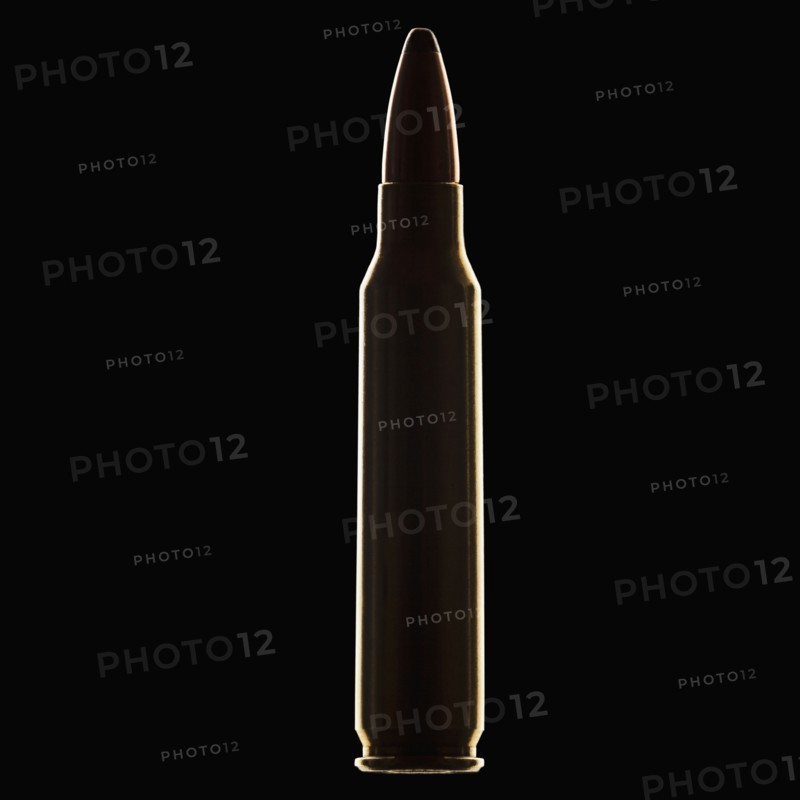 Single bullet on black background, close-up. Photo : Mike Kemp