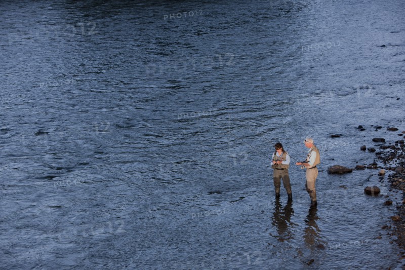 Canada, British Columbia, Fernie, Couple fly fishing in river. Photo : Dan Bannister