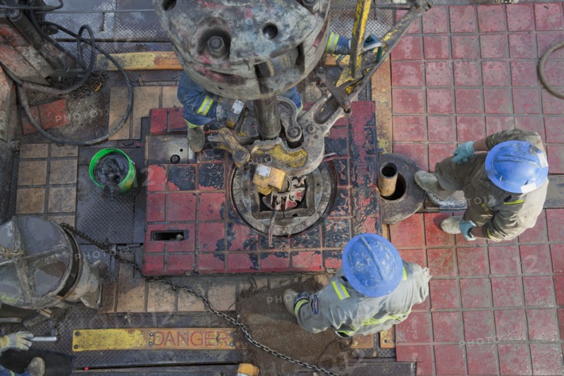 Oil workers drilling for oil on rig. Photo : Dan Bannister
