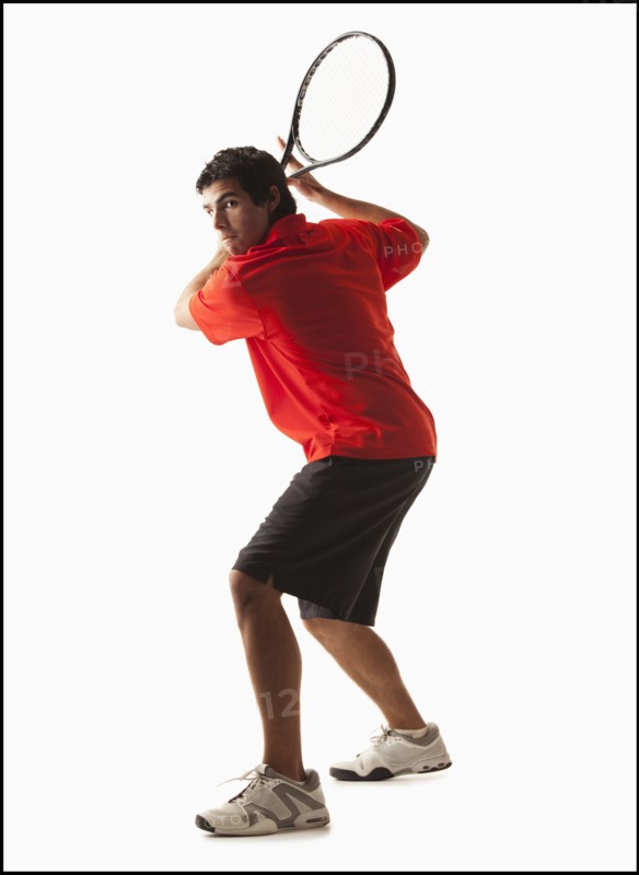 Young man playing tennis. Photo : Mike Kemp