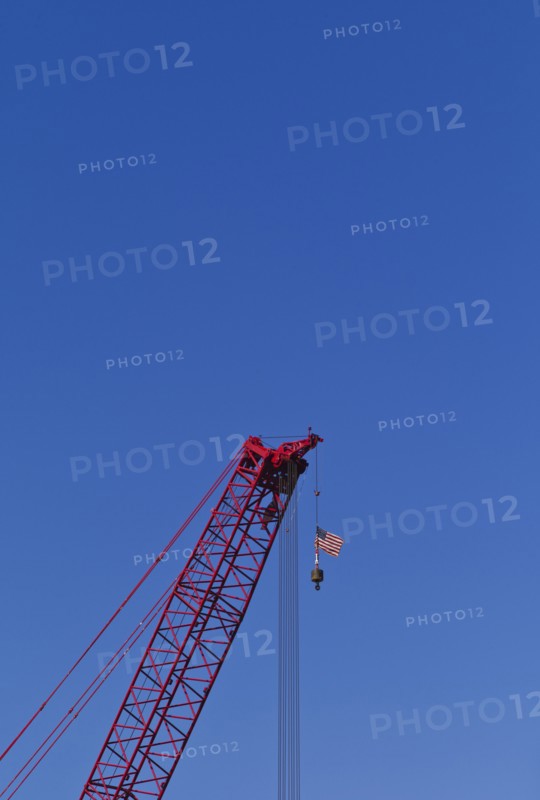 USA, New York, New York City, Construction crane with American flag.
