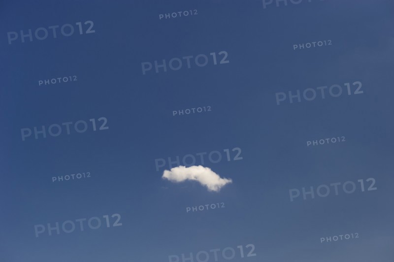 Single cloud in blue sky.
