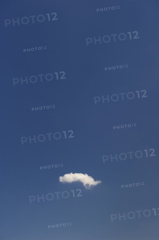 Single cloud in blue sky.