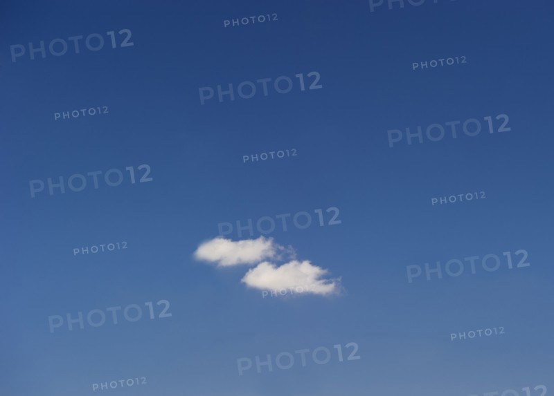 Single cloud in blue sky.