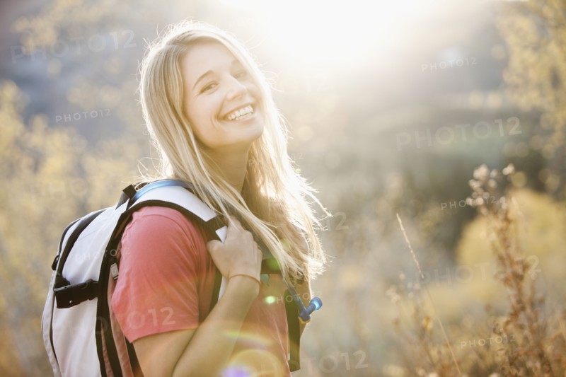USA, Utah, portrait of young woman hiking in forest. Photo : Mike Kemp