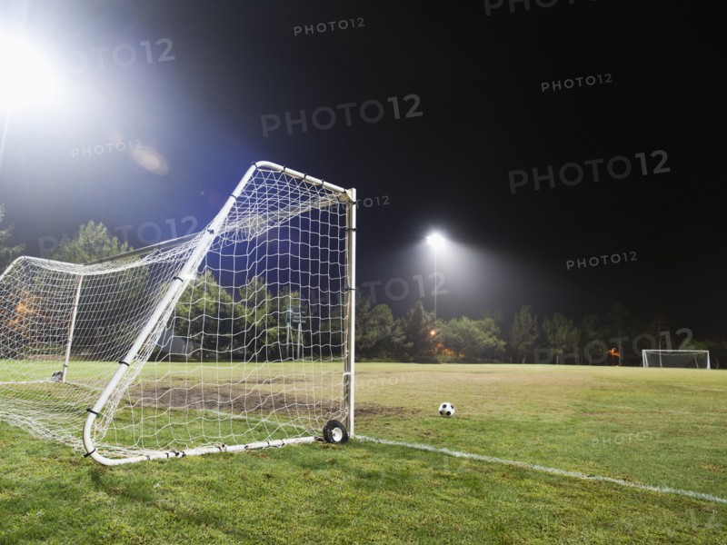 USA, California, Ladera Ranch, illuminated soccer field at night.