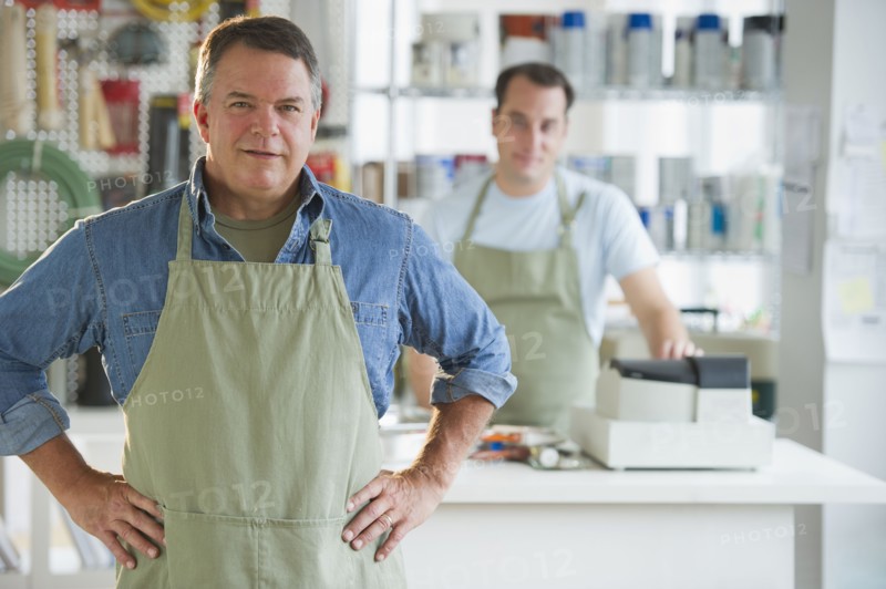USA, New Jersey, Jersey City, Portrait of hardware shop owner and assistant.