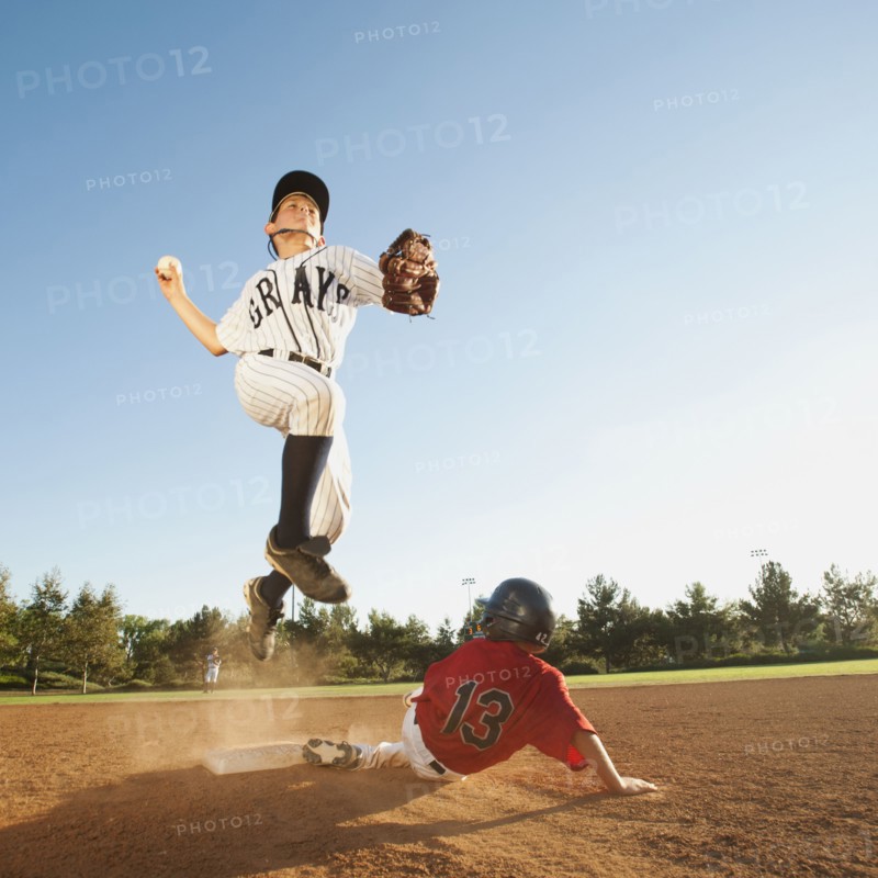 Boys (10-11) playing baseball.