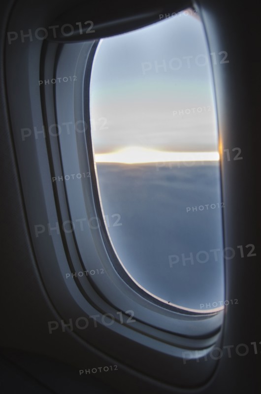 Clouds seen through airplane window.