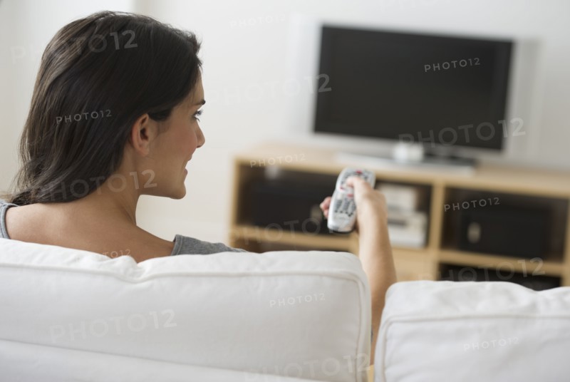 Woman watching tv.